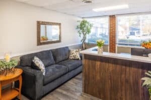Soft seating next to the reception desk at the West Village facility