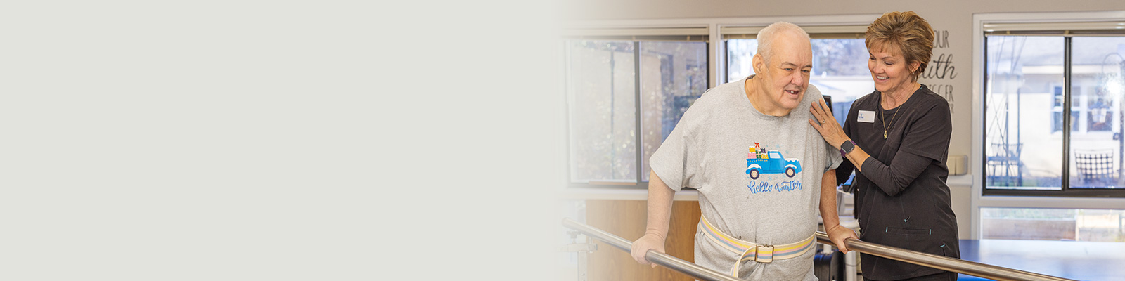 A rehab therapist with a a resident in the rehab gym at West Village Care